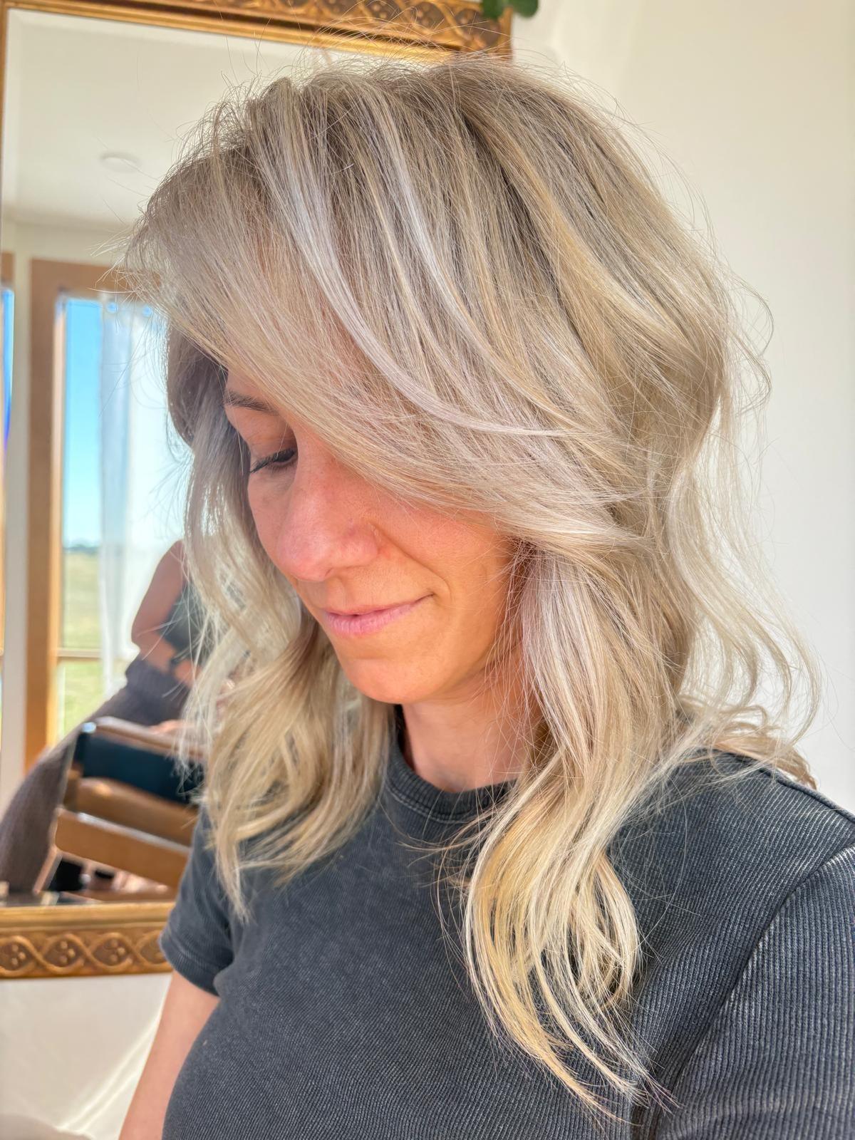 Lived-in blonde layers in the salon, looking down