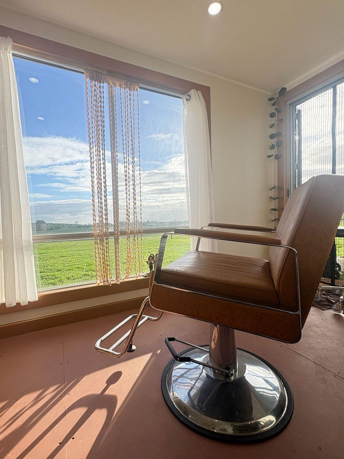 Styling chair beside the window and the paddock
