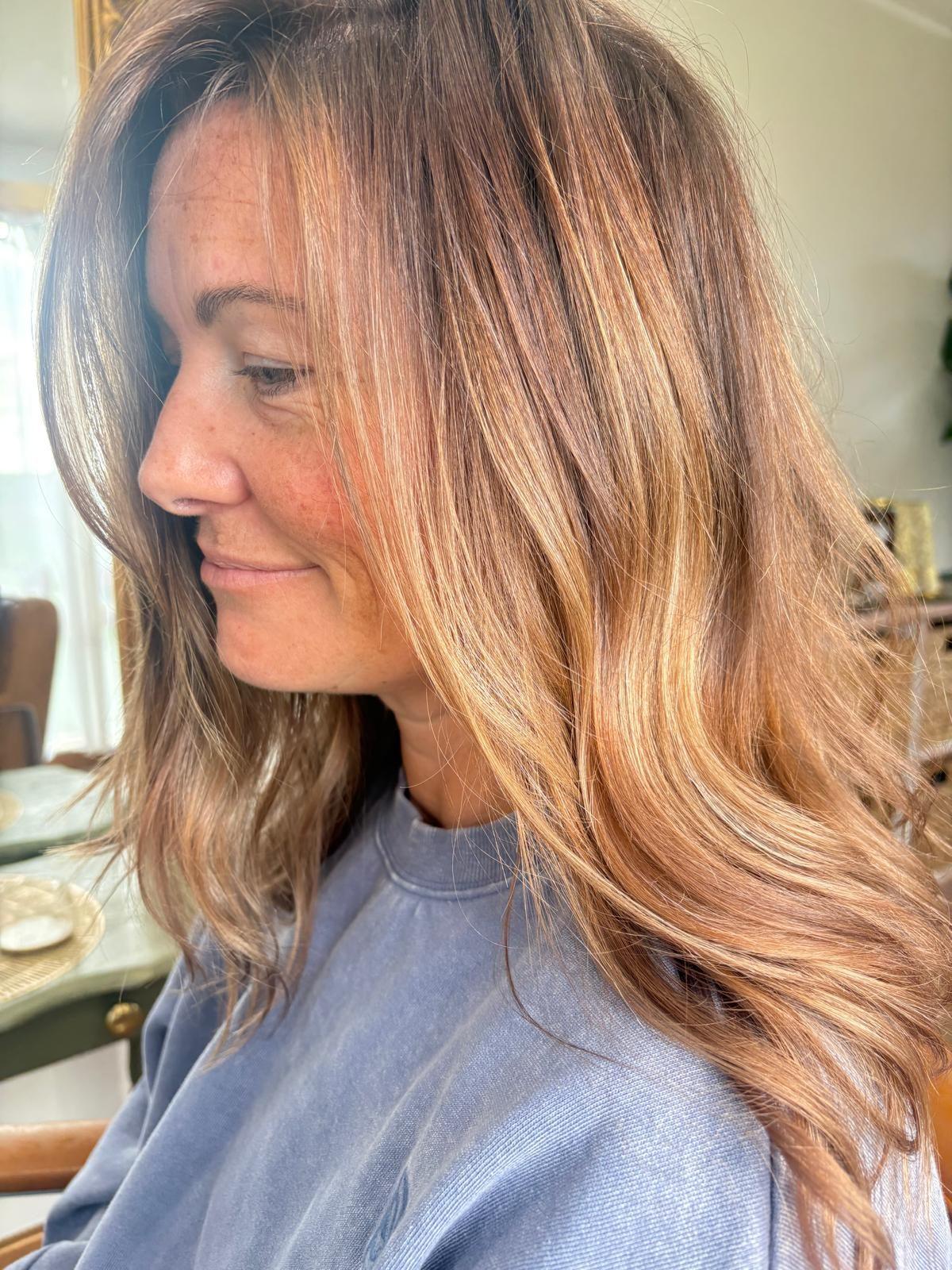 Caramel highlights through long brunette hair